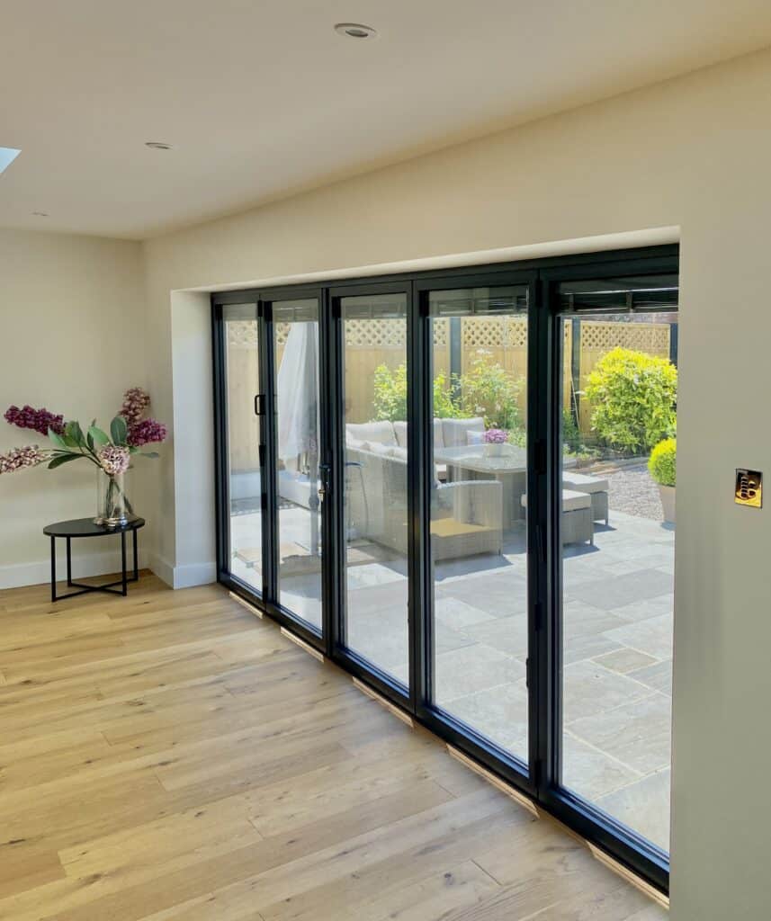 Alunet BF73 bifold doors in a modern room setting