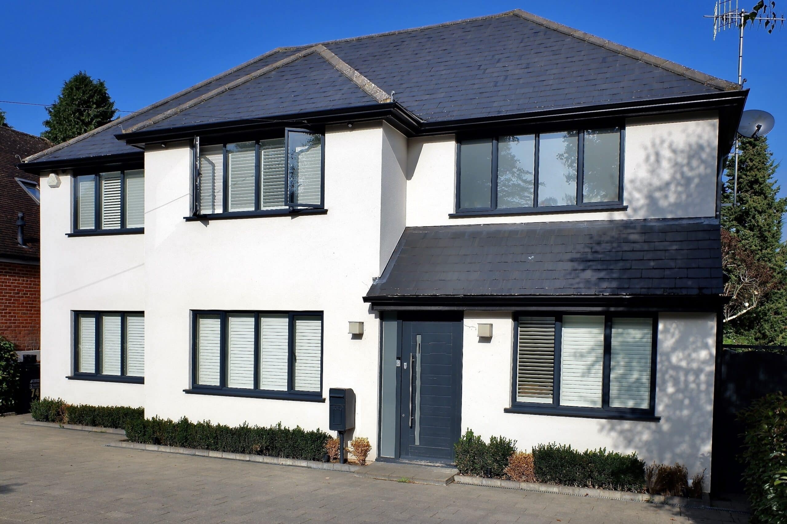 grey aluminium windows in a white rendered house