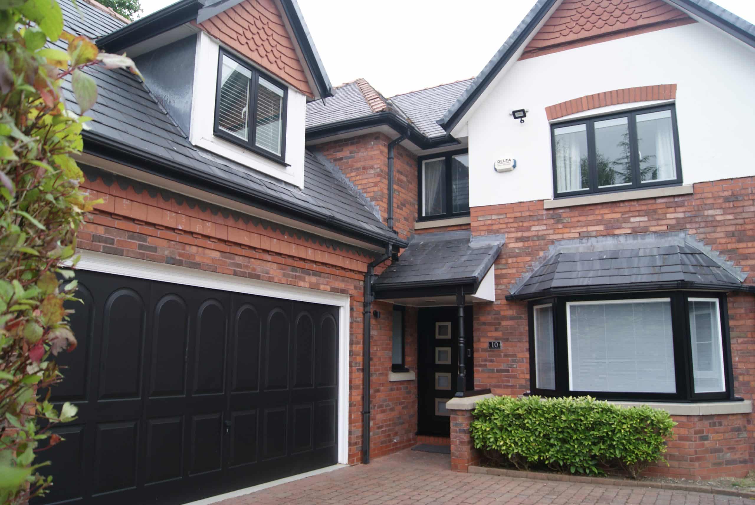 House with black slimline windows